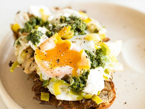 Classic poached eggs served on toast with runny yolk